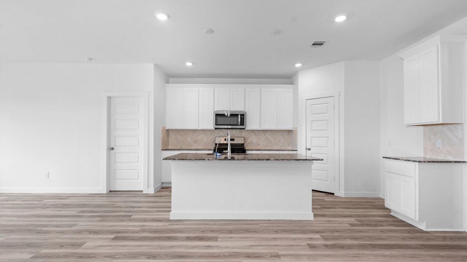 13 Robin Court Angleton, TX 77515 - Photo 6 of 27 a kitchen with stainless steel appliances granite countertop a refrigerator and a stove top oven