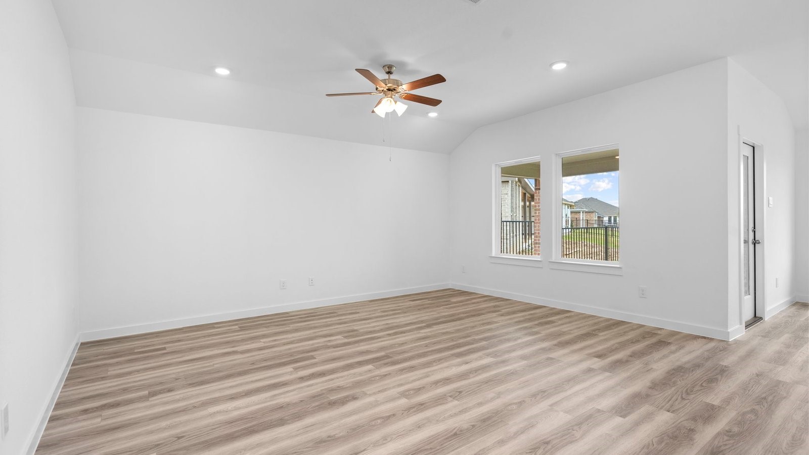 13 Robin Court Angleton, TX 77515 - Photo 9 of 27 wooden floor in an empty room with a window