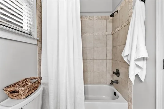 a kitchen with stainless steel appliances granite countertop a stove microwave and refrigerator