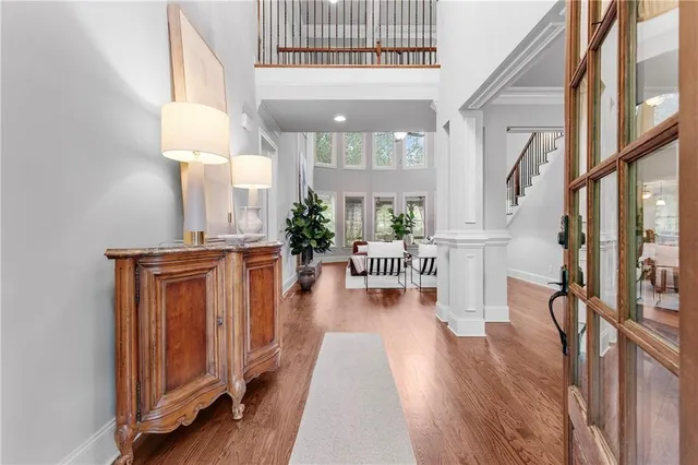 a view of a dining room with furniture window and wooden floor