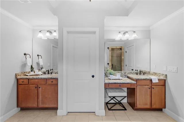 a bedroom with a bed and a large mirror