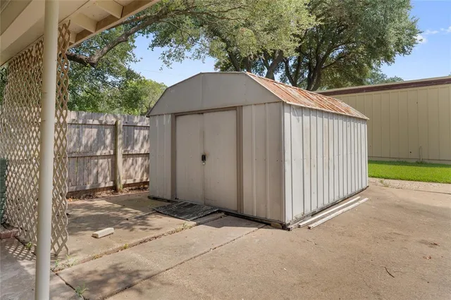a backyard of a house with a tree
