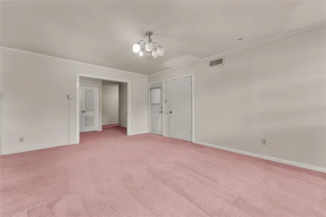 a kitchen with cabinets appliances and a ceiling fan