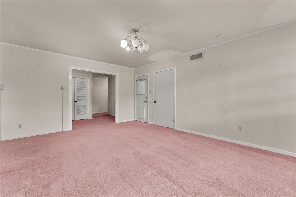 3216 MacArthur Drive Waco, TX 76708 - Photo 21 of 39 a view of an empty room with a chandelier