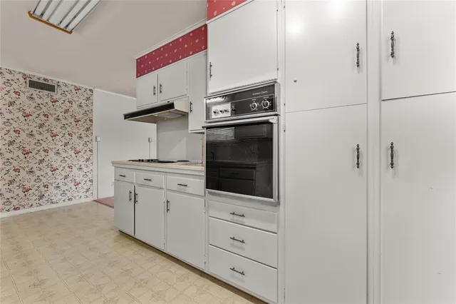 a bathroom with a sink and a window