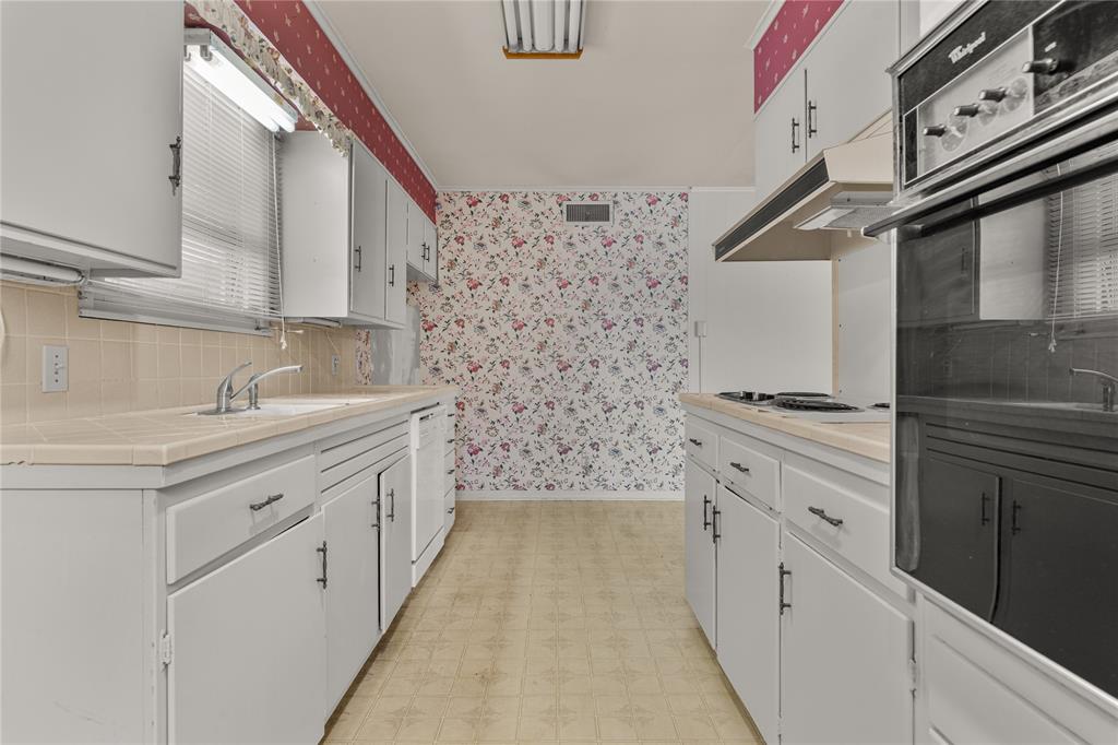 3216 MacArthur Drive Waco, TX 76708 - Photo 25 of 39 a bathroom with a granite countertop sink a large mirror and a shower