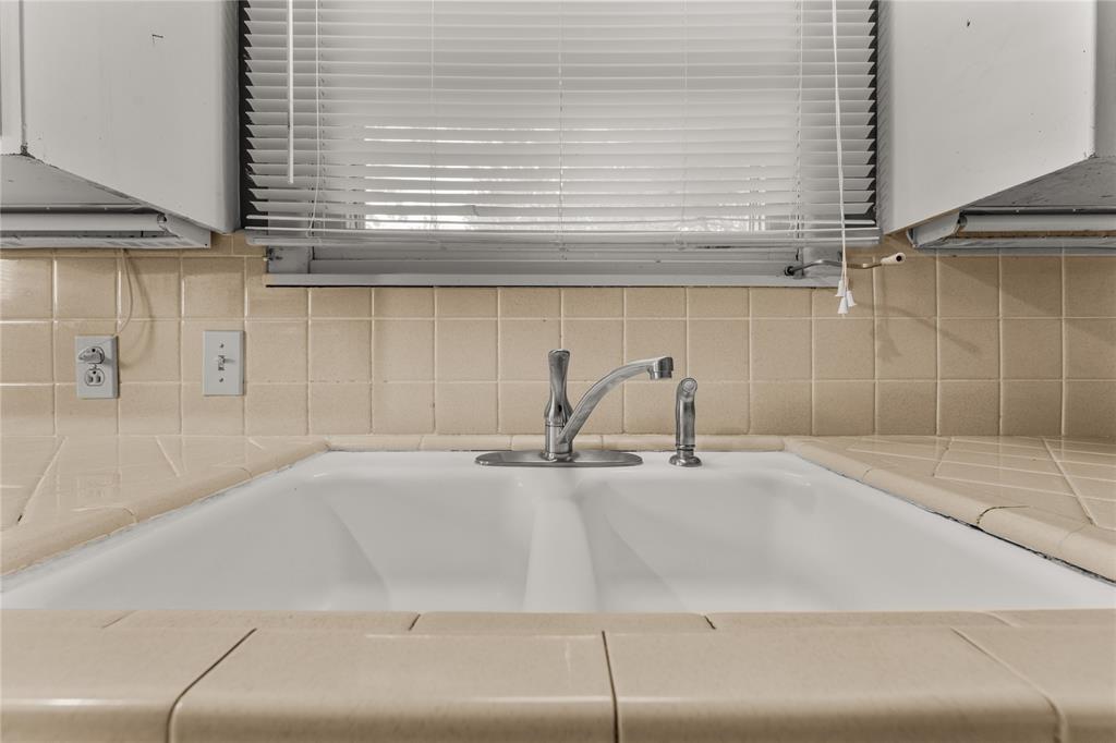 3216 MacArthur Drive Waco, TX 76708 - Photo 26 of 39 a bathroom with a sink and a window
