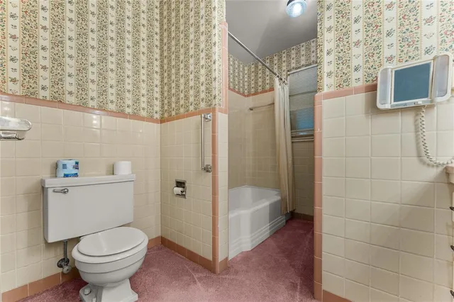 a bathroom with a bathtub and shower