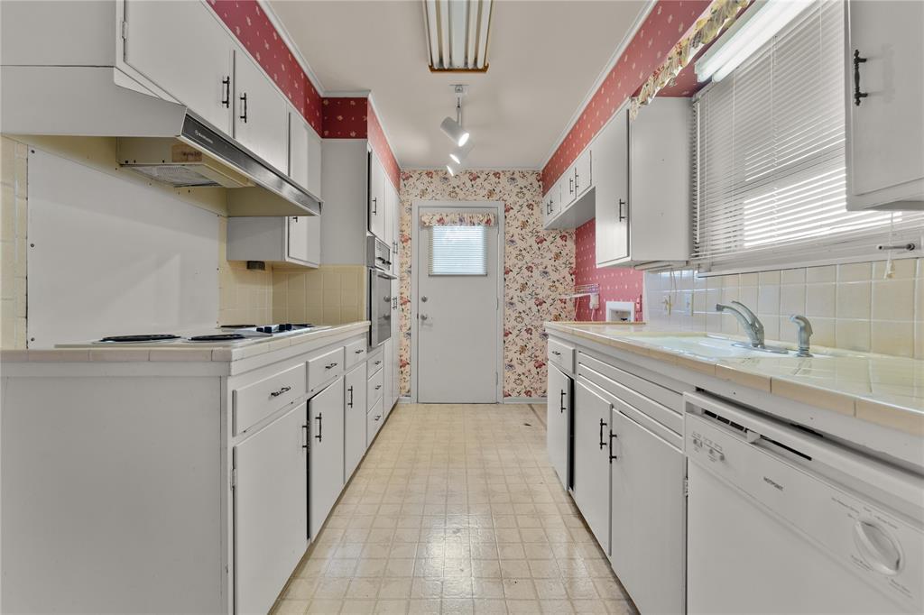 3216 MacArthur Drive Waco, TX 76708 - Photo 3 of 39 a kitchen with cabinets a sink and appliances