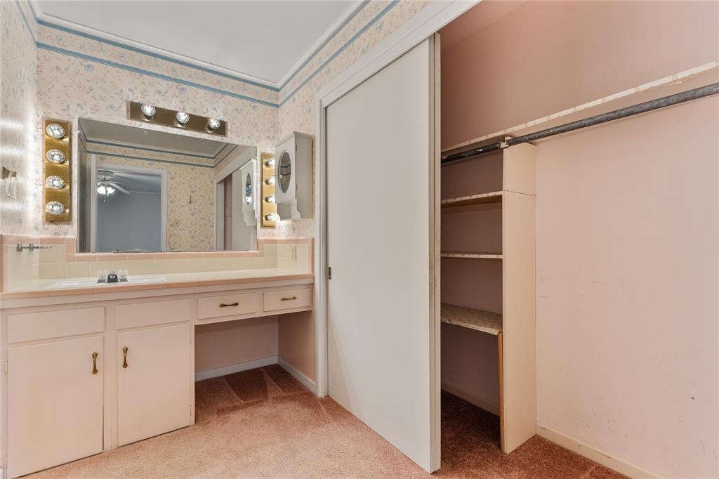 3216 MacArthur Drive Waco, TX 76708 - Photo 37 of 39 a bathroom with a double vanity sink and mirror