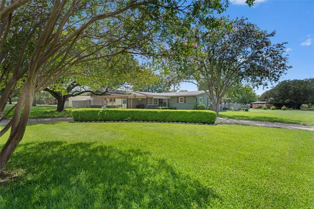 a view of a house with a big yard