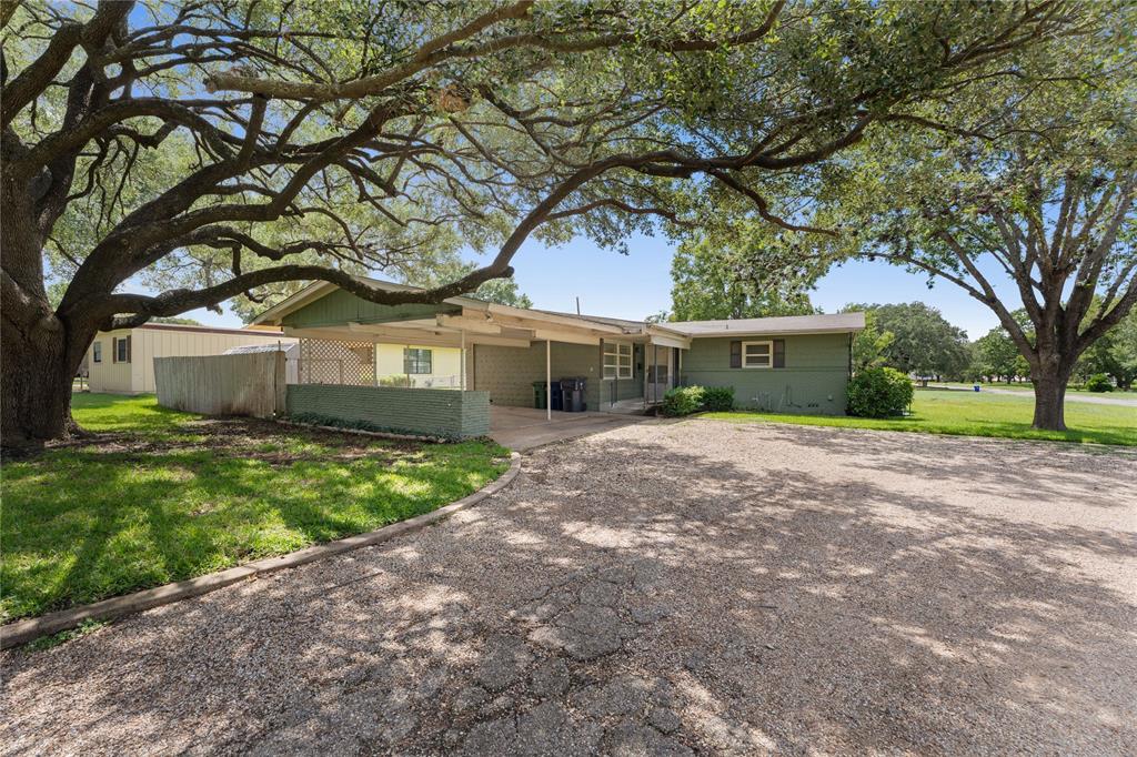 3216 MacArthur Drive Waco, TX 76708 - Photo 9 of 39 a front view of a house with garden