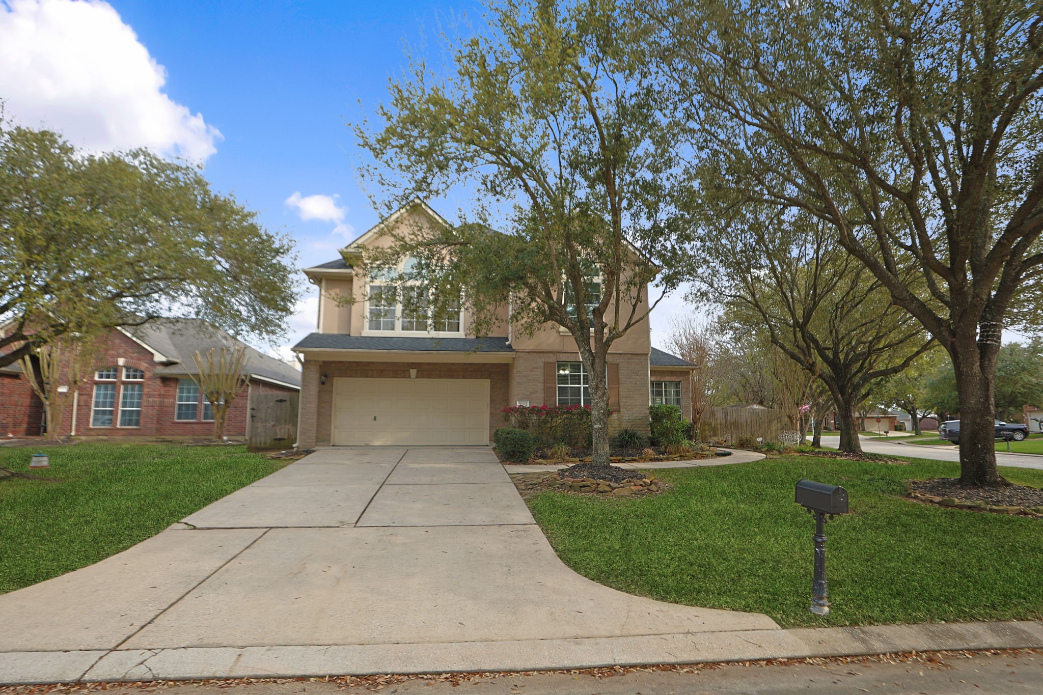 20102 Windbury Court Spring, TX 77379 - Photo 5 of 49 a front view of a house with a yard and trees