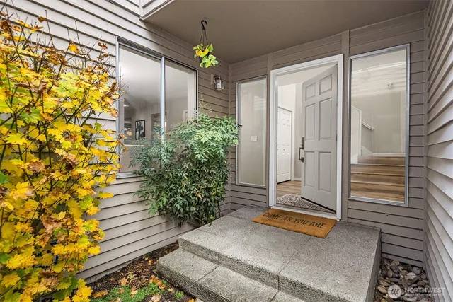 a view of a balcony with potted plants
