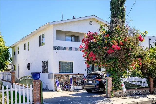 a front view of a house with yard