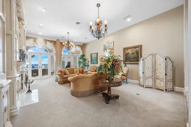 a bedroom with furniture and a large window