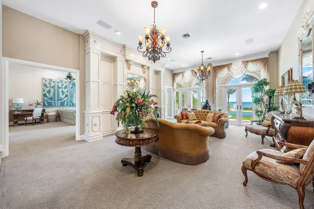 a bedroom with furniture and a chandelier