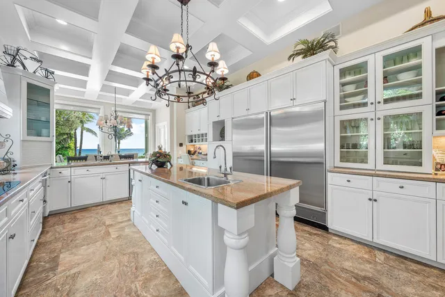 a living room with furniture and large windows