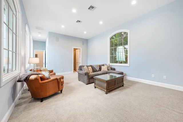 a view of a livingroom with furniture window and wooden floor
