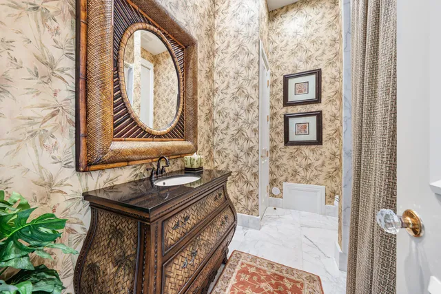 a view of a backyard with swimming pool and sitting area