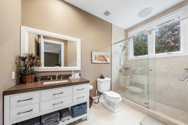 a view of a swimming pool and an outdoor seating