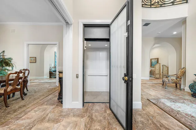 a view of a livingroom with wooden floor and furniture