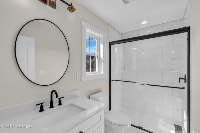 a bathroom with a sink a mirror and a bathtub