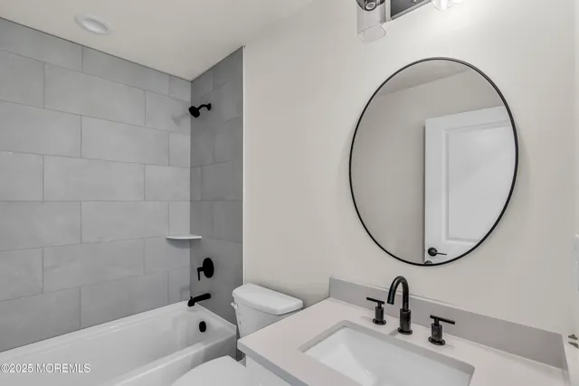 a bathroom with a sink a mirror and a vanity