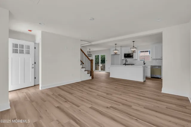 a living room with furniture window and wooden floor