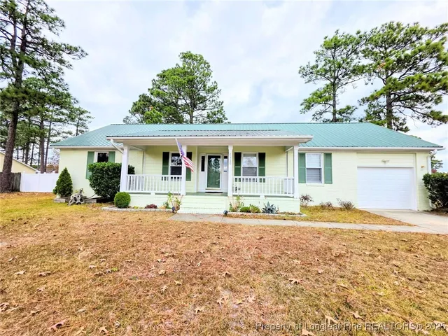a front view of a house with a patio