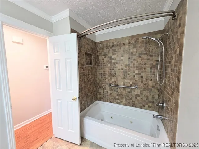 a bathroom with a shower and a bathtub