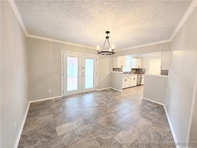 a view of a kitchen with refrigerator and microwave