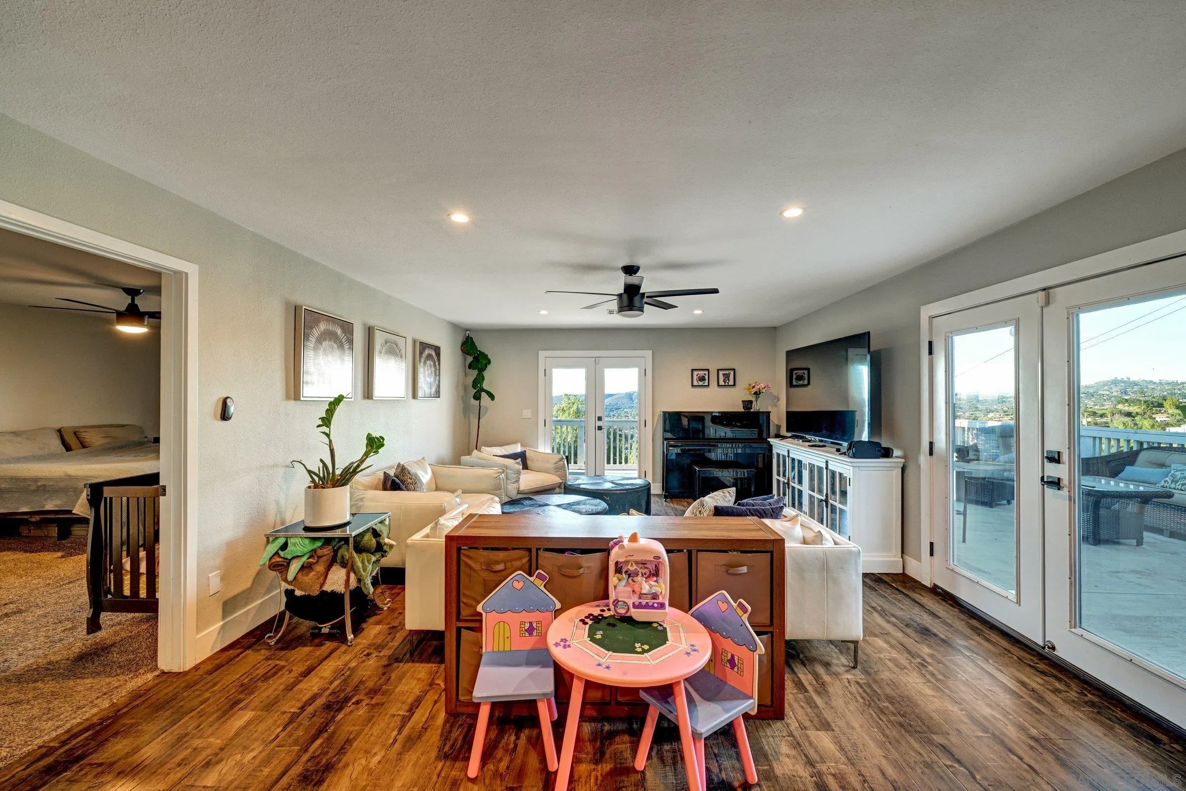 2312 Helix Street Spring Valley, CA 91977 - Photo 24 of 46 a view of a dining room with furniture window and wooden floor