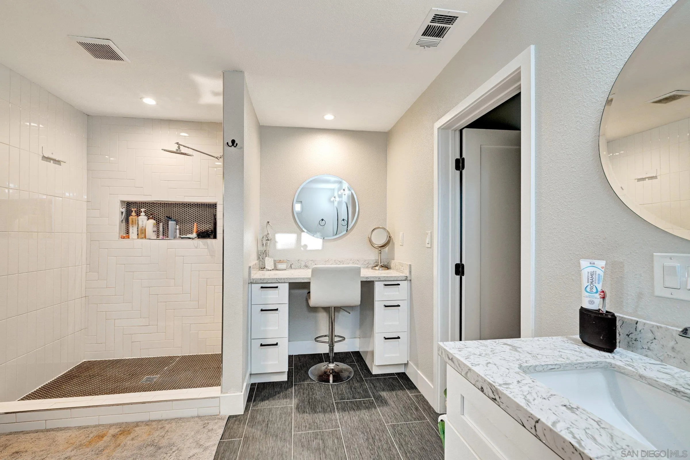 2312 Helix Street Spring Valley, CA 91977 - Photo 32 of 46 a bedroom with a bed and a mirror