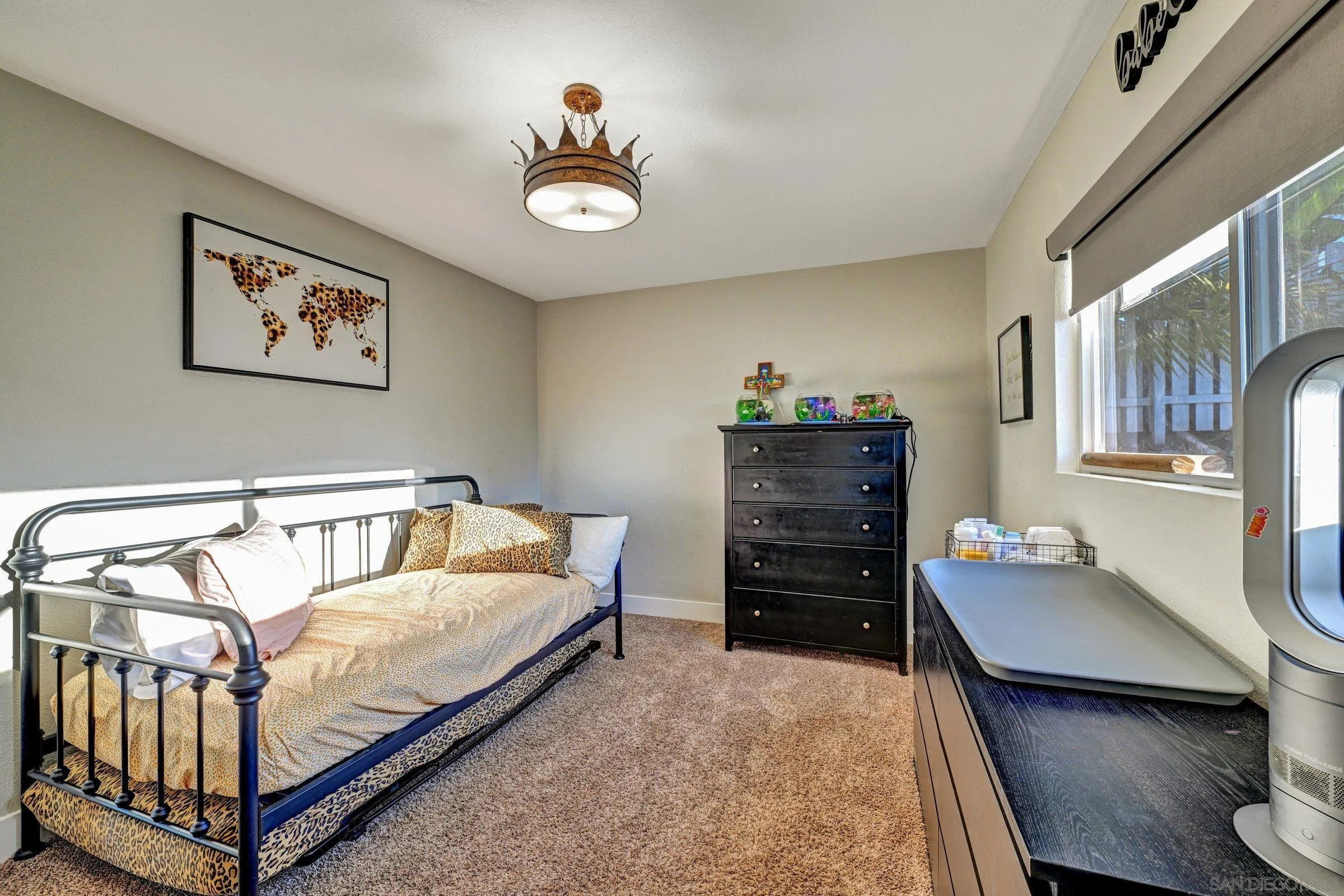 2312 Helix Street Spring Valley, CA 91977 - Photo 34 of 46 a bedroom with a bed and a dresser