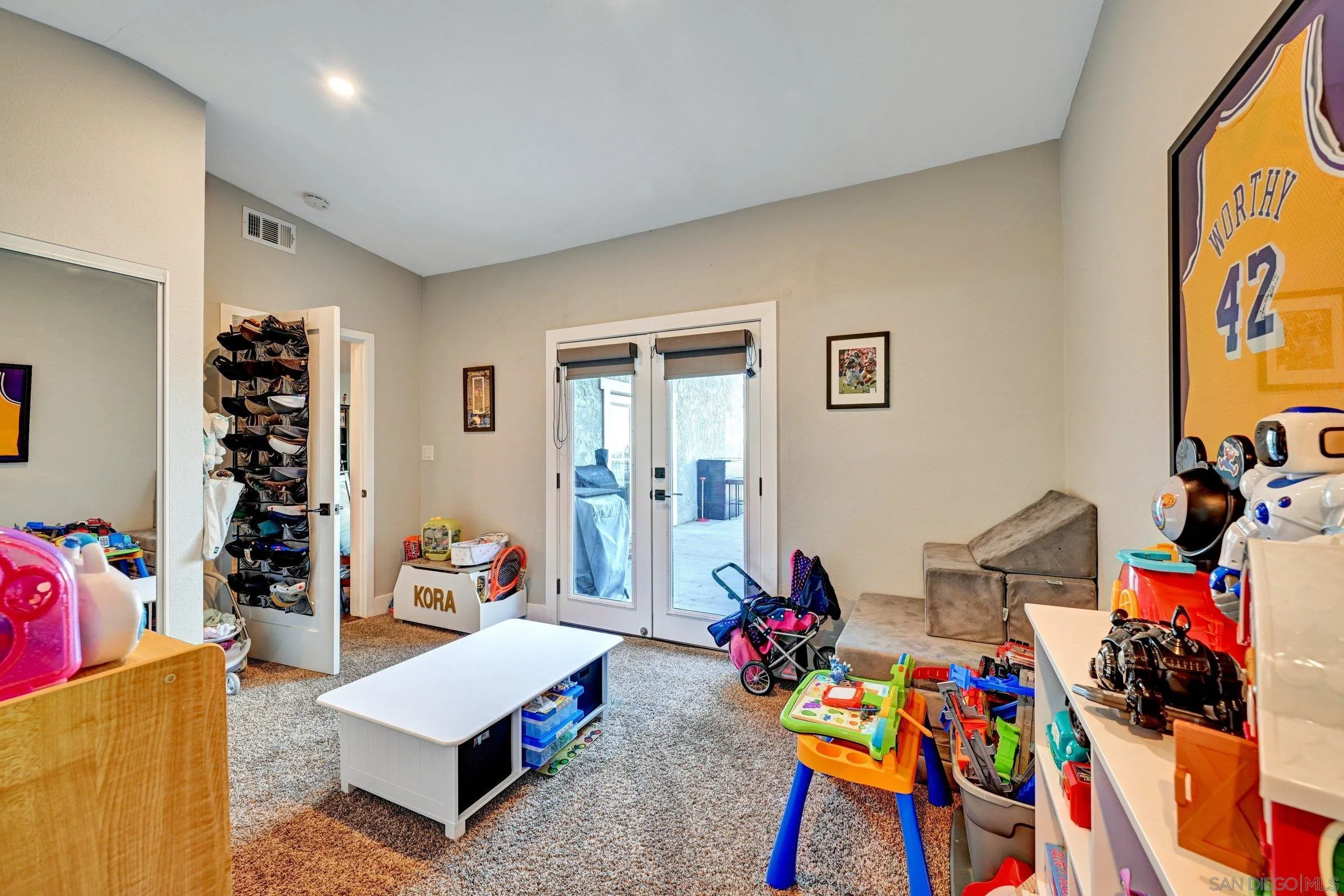 2312 Helix Street Spring Valley, CA 91977 - Photo 36 of 46 a living room with furniture and gym equipment