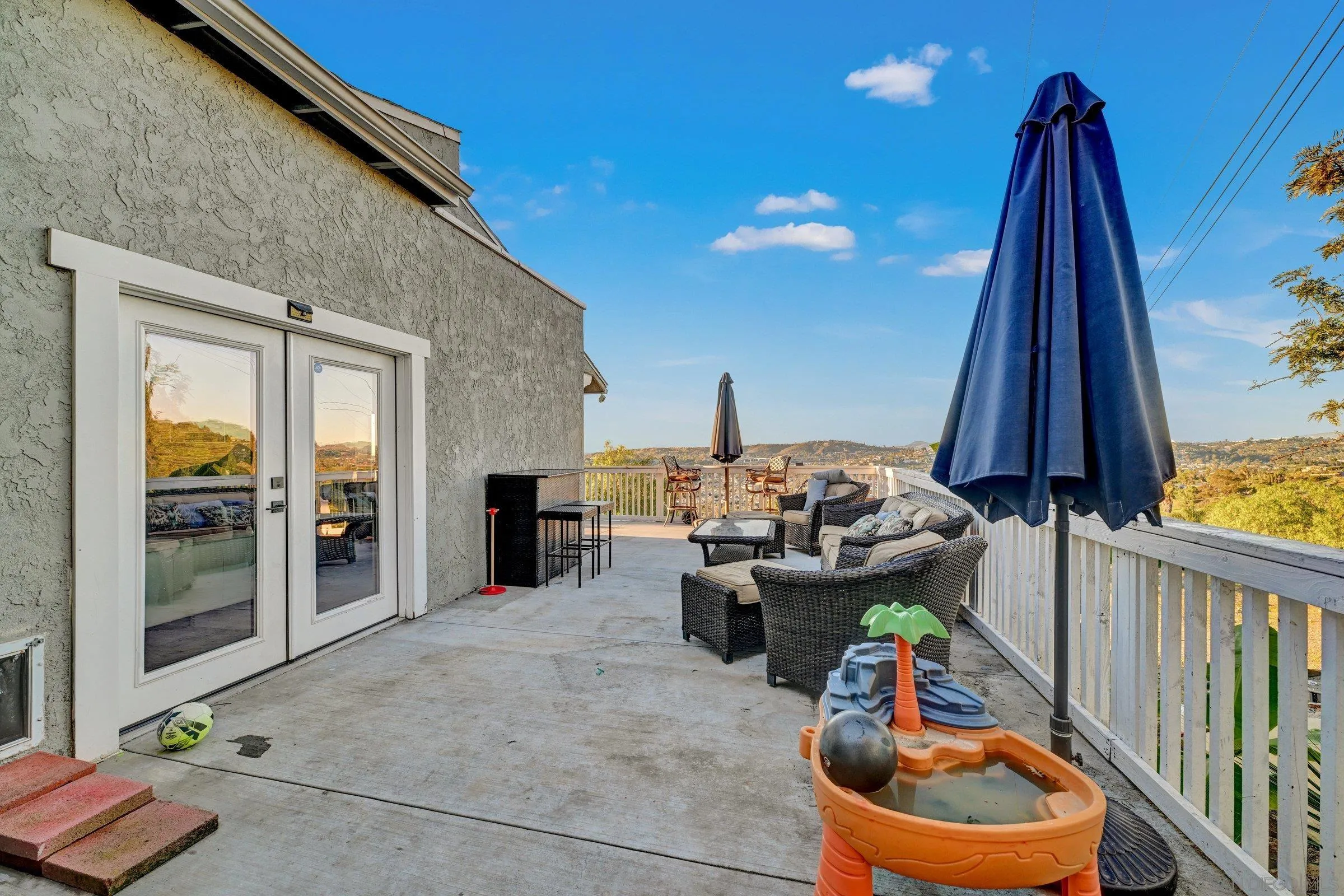 2312 Helix Street Spring Valley, CA 91977 - Photo 40 of 46 a view of roof deck with dining table and chairs