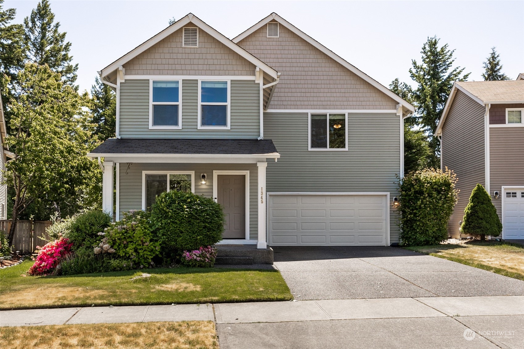 1345 Foreman Road DuPont, WA 98327 - Photo 1 of 34 a front view of a house with a yard
