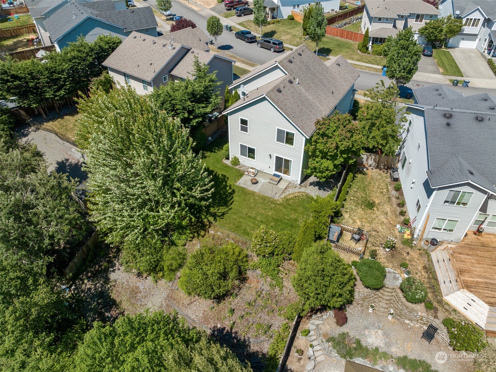 1345 Foreman Road DuPont, WA 98327 - Photo 32 of 34 an aerial view of a house with a yard and large trees