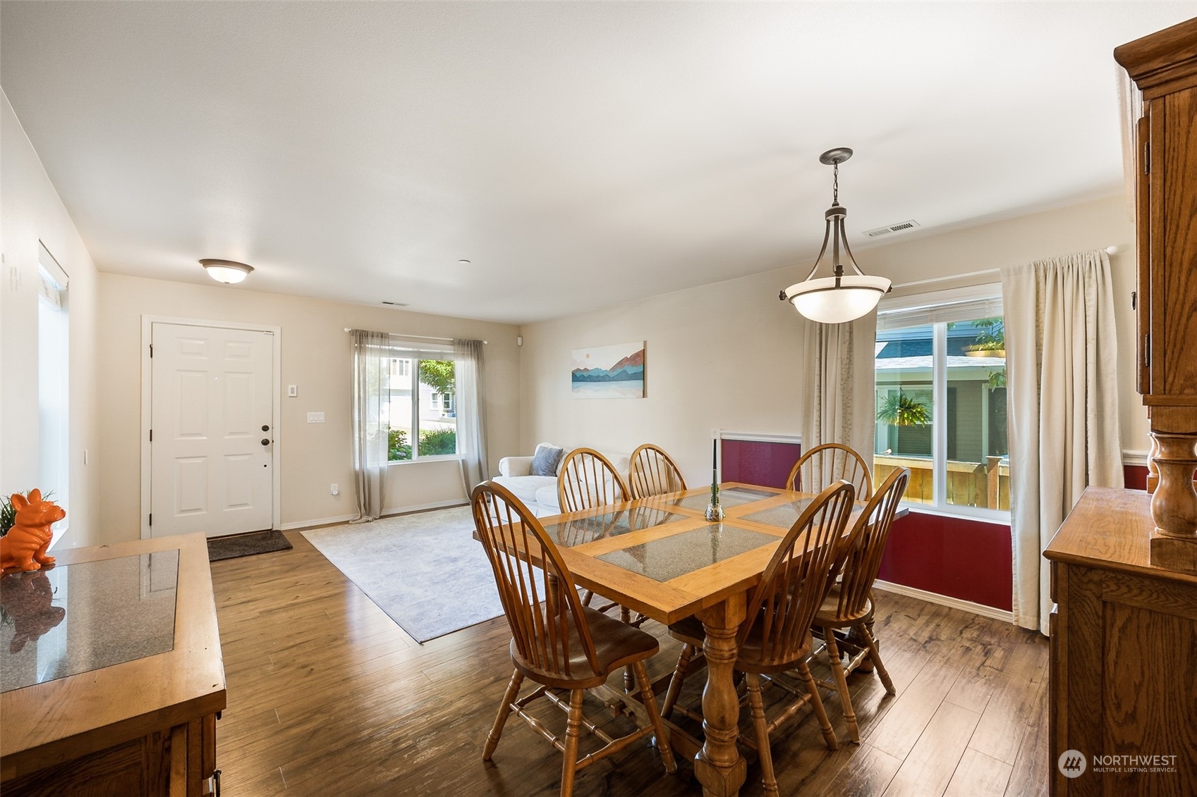 1345 Foreman Road DuPont, WA 98327 - Photo 5 of 34 a view of a dining room with furniture window and wooden floor