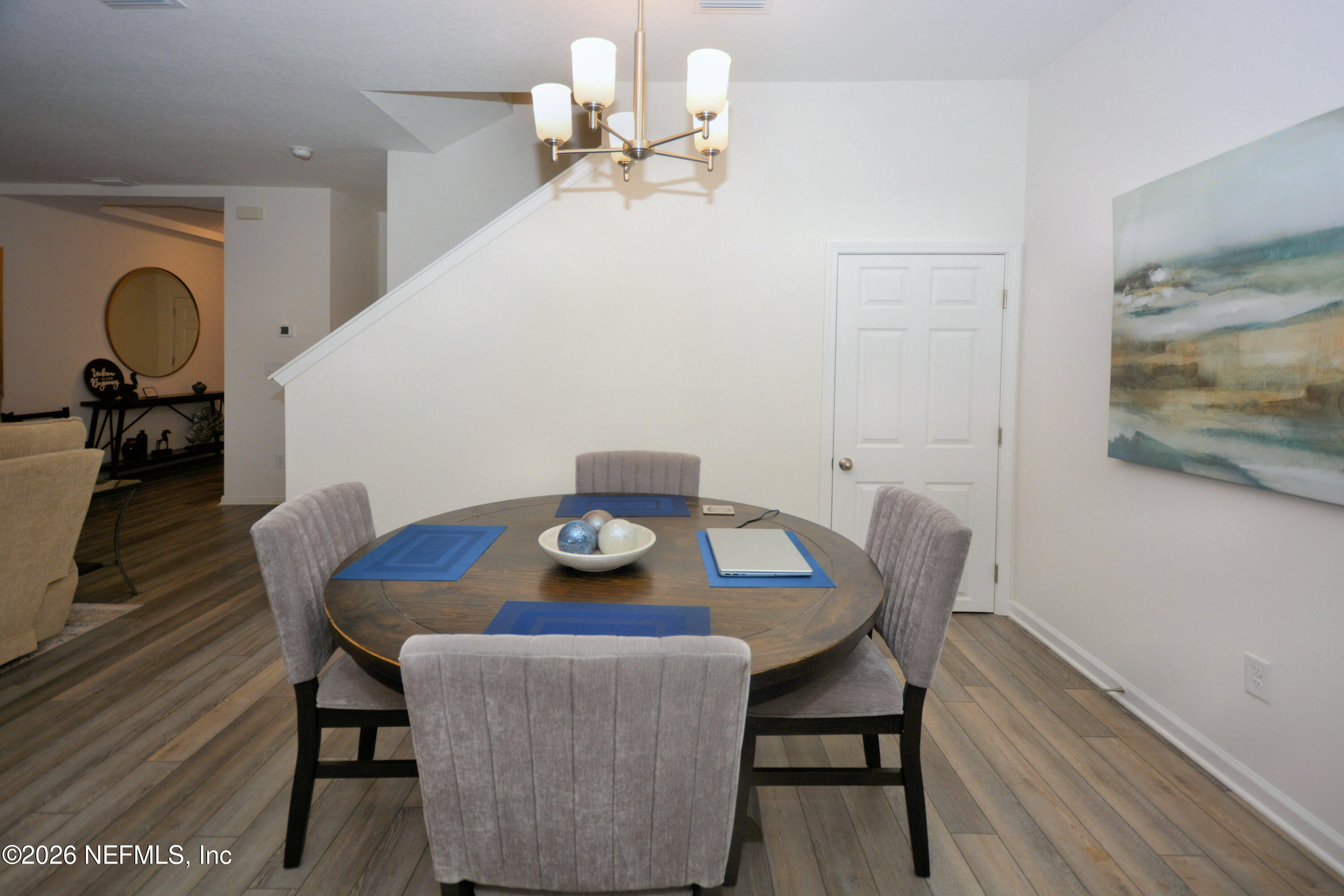 1688 Sanctuary Way Fleming Island, FL 32003 - Photo 13 of 35 a view of a dining room with furniture and wooden floor