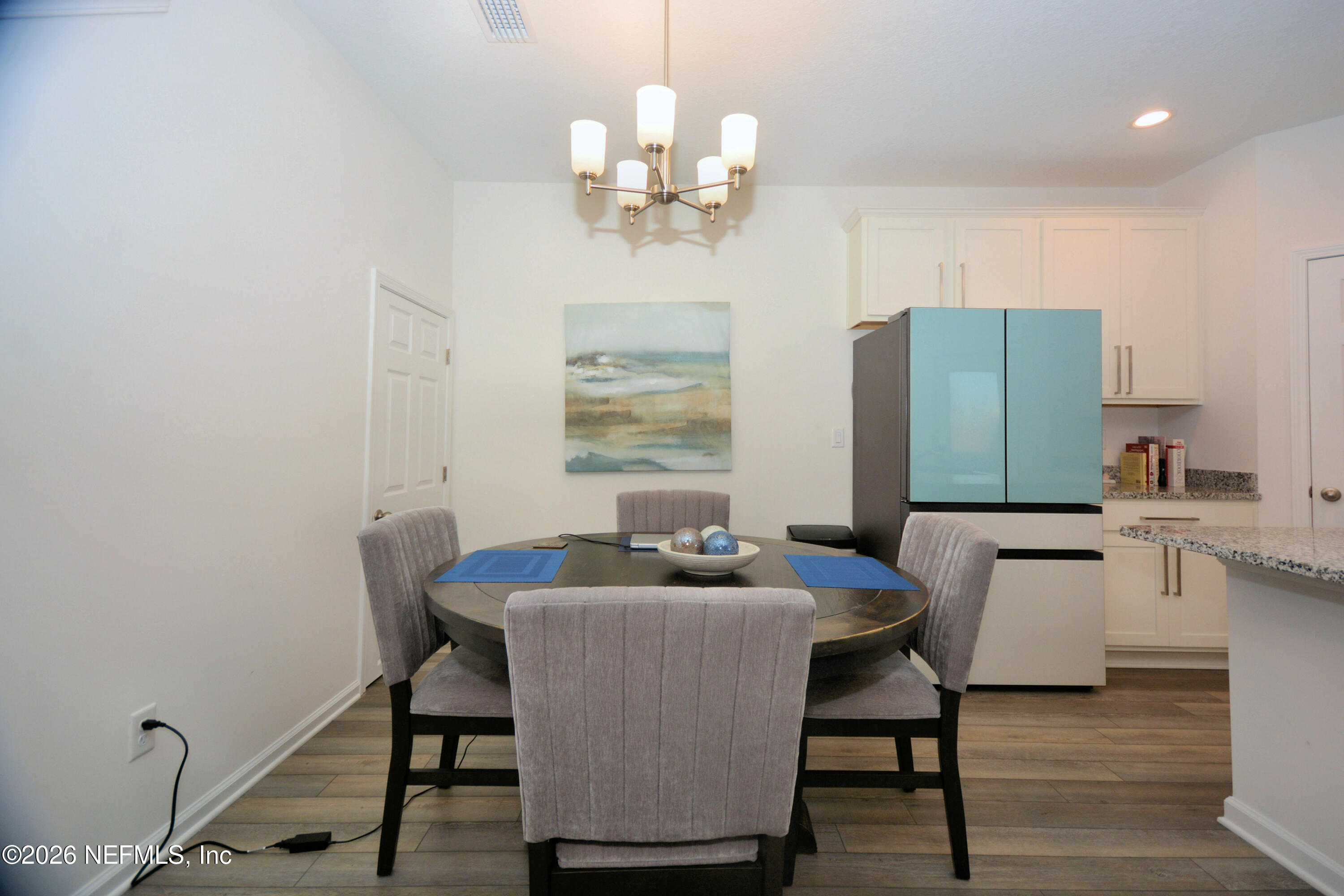 1688 Sanctuary Way Fleming Island, FL 32003 - Photo 14 of 35 a dining room with furniture and window