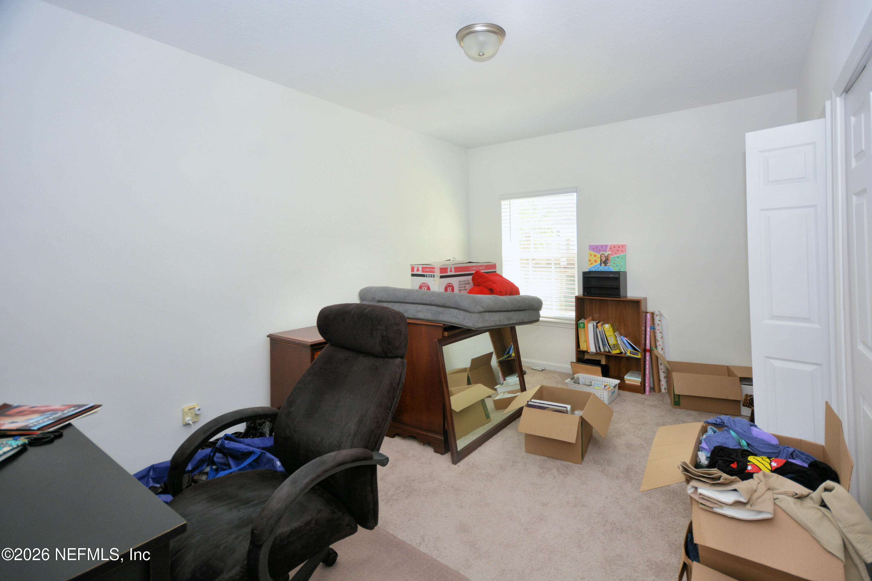 1688 Sanctuary Way Fleming Island, FL 32003 - Photo 23 of 35 a room with furniture and a couch