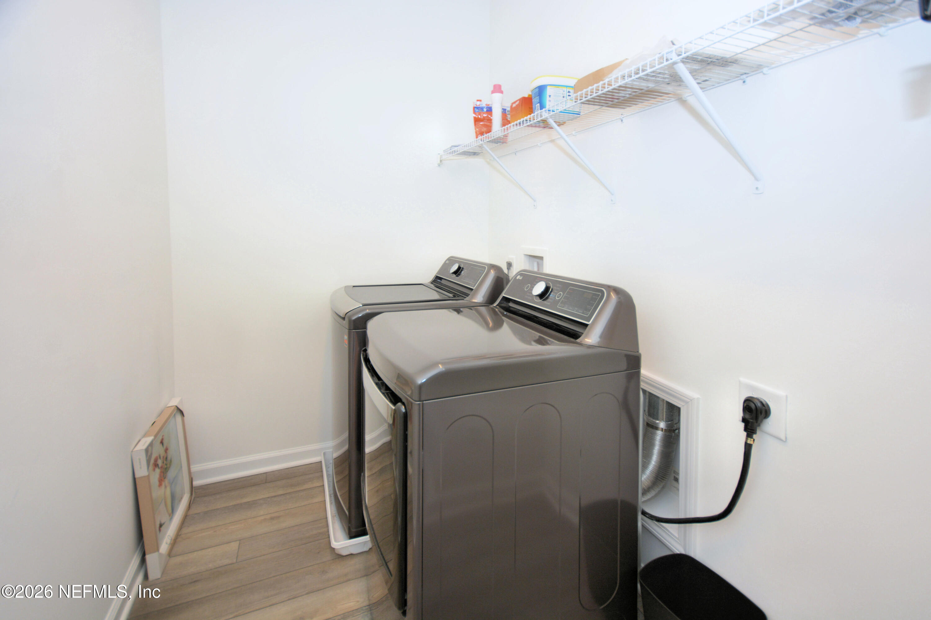 1688 Sanctuary Way Fleming Island, FL 32003 - Photo 25 of 35 a utility room with dryer and washer
