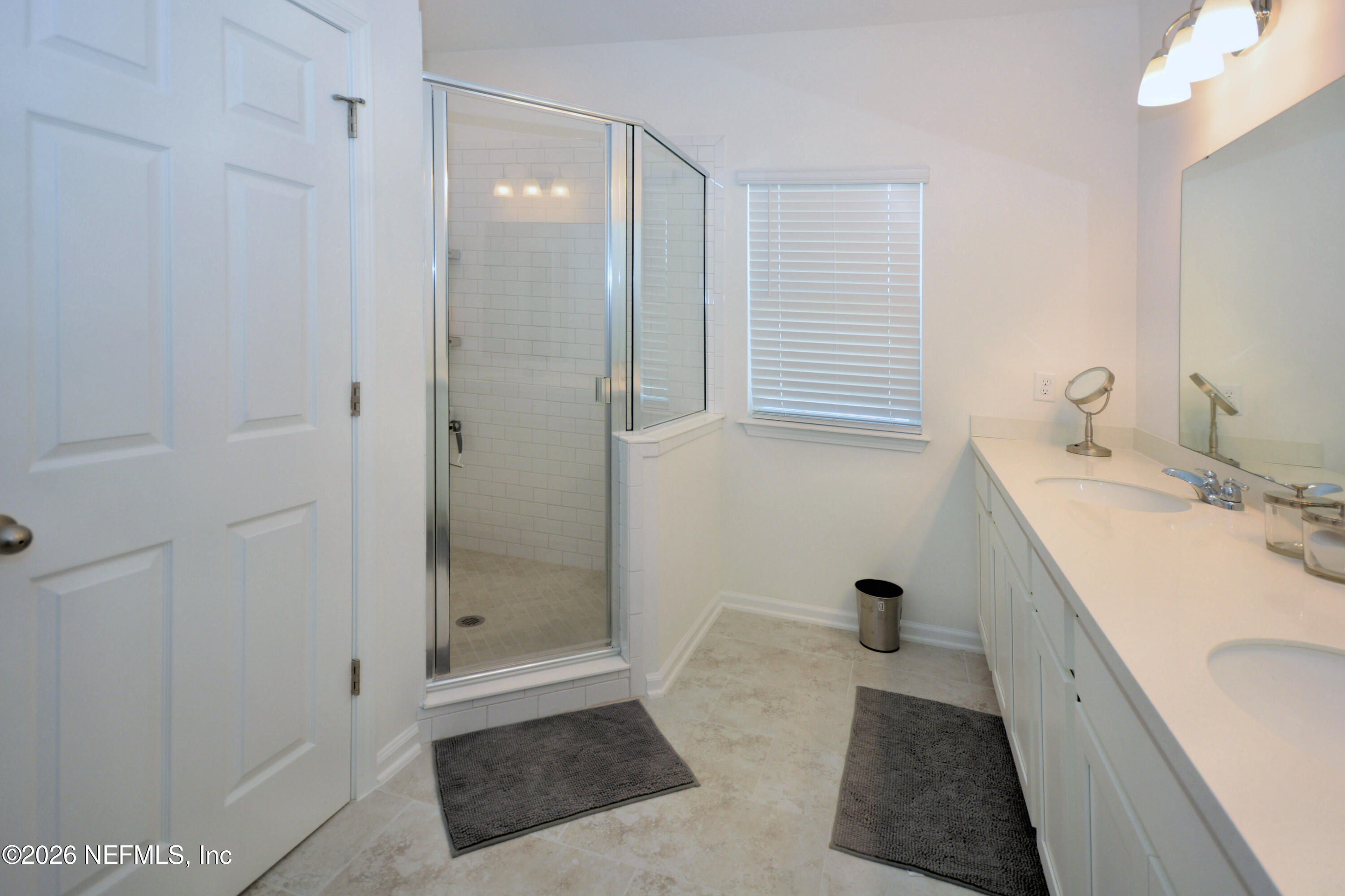 1688 Sanctuary Way Fleming Island, FL 32003 - Photo 27 of 35 a bathroom with a tub sink and shower