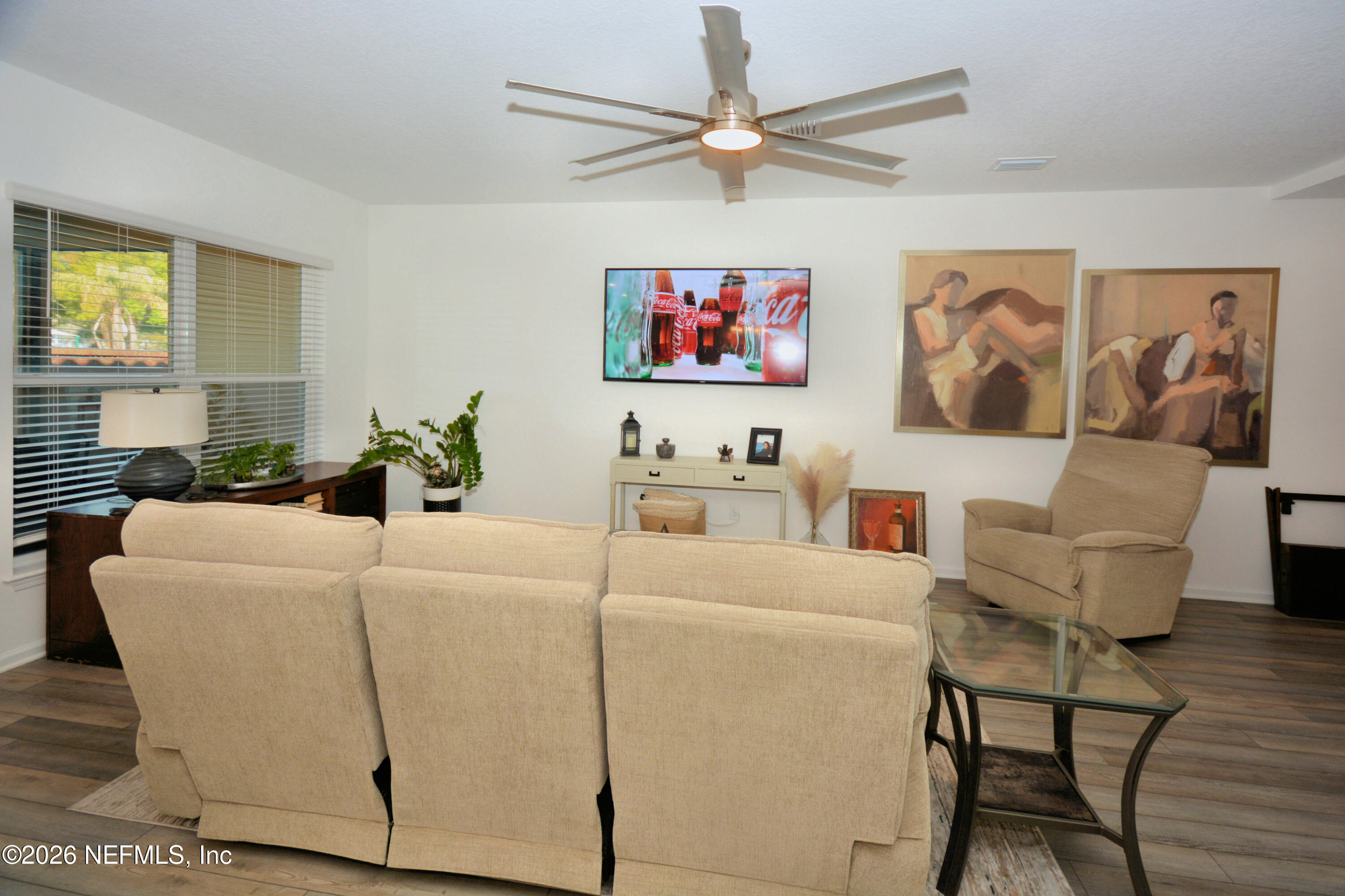 1688 Sanctuary Way Fleming Island, FL 32003 - Photo 7 of 35 a living room with furniture and a window
