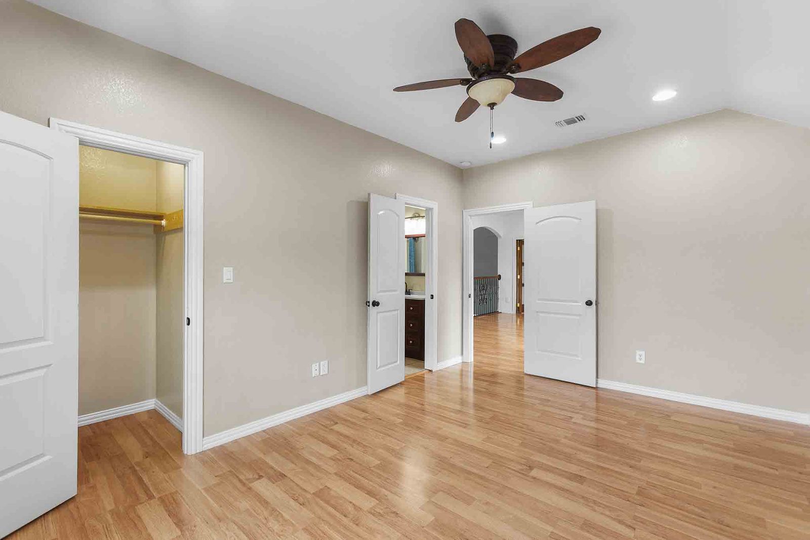 323 Woodbrook Trail Buda, TX 78610 - Photo 18 of 40 Spacious room featuring vaulted ceilings, wood-finish flooring, recessed lighting, and a ceiling fan