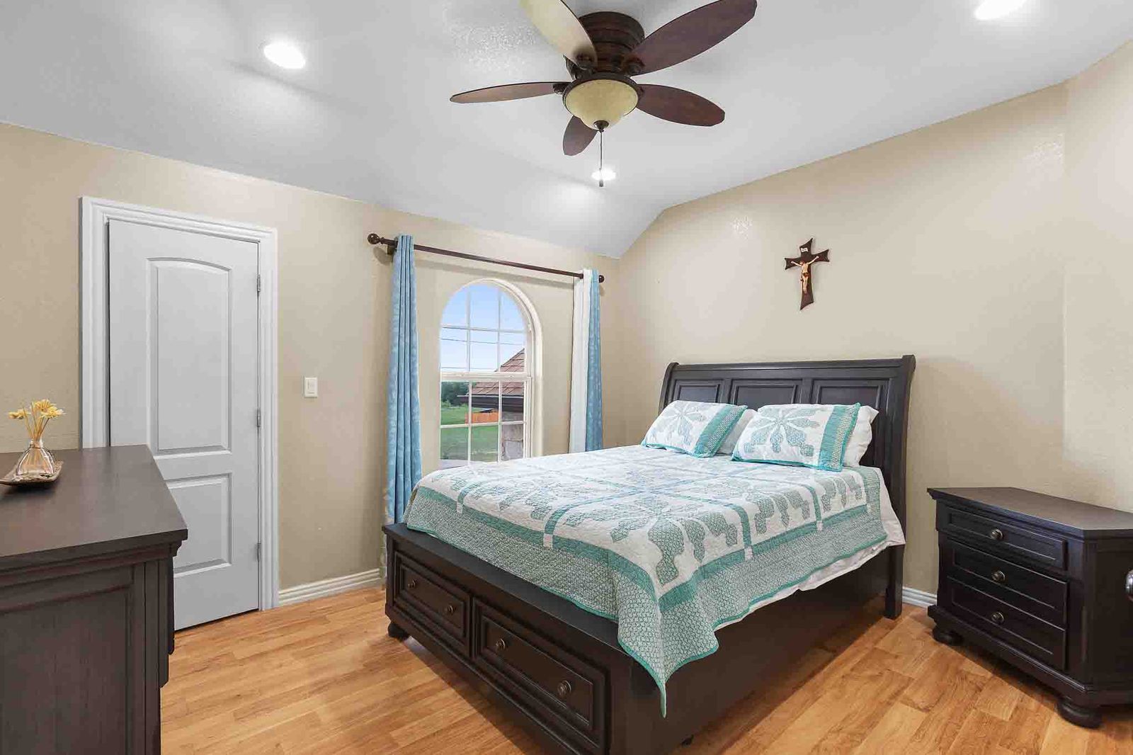 323 Woodbrook Trail Buda, TX 78610 - Photo 19 of 40 Wood-finish flooring throughout, complemented by a ceiling fan with integrated lighting