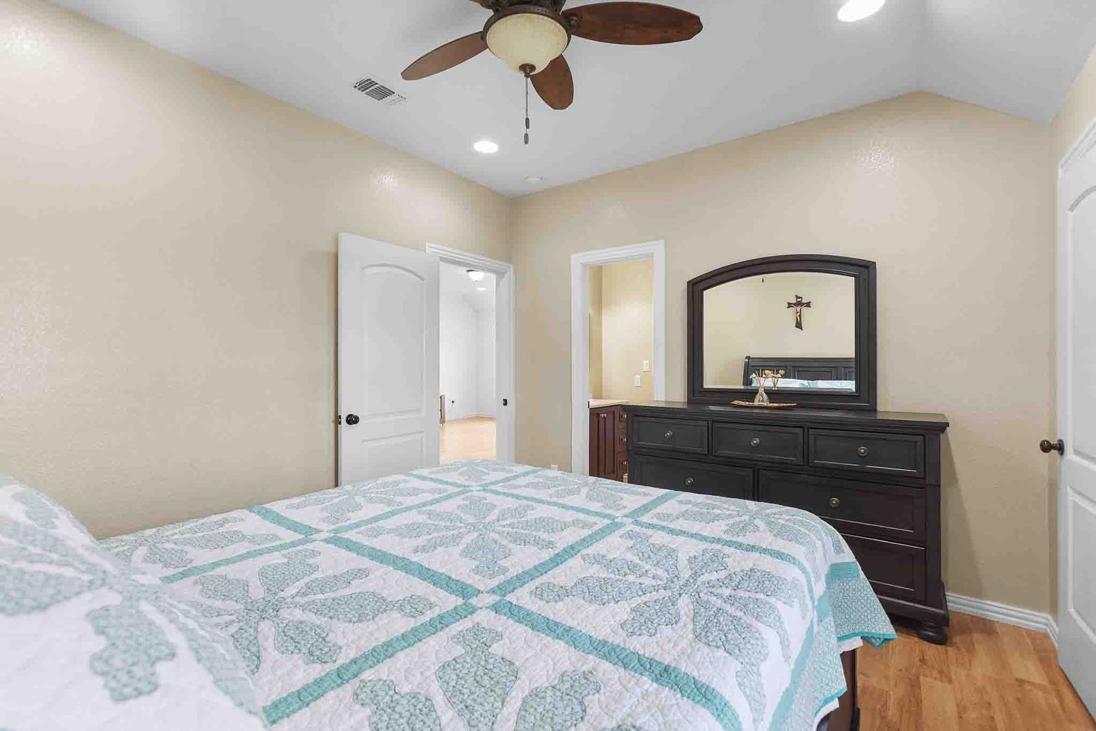 323 Woodbrook Trail Buda, TX 78610 - Photo 20 of 40 Bedroom featuring wood-finish flooring, vaulted ceilings, and recessed lighting