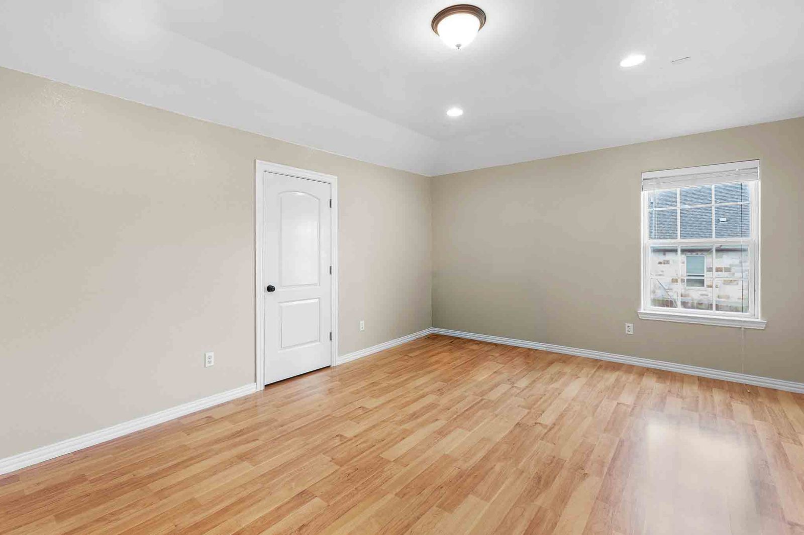 323 Woodbrook Trail Buda, TX 78610 - Photo 27 of 40 Spacious media room featuring wood-finish flooring and neutral wall tones